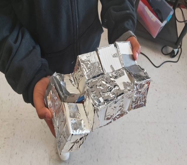 student making flexi cube